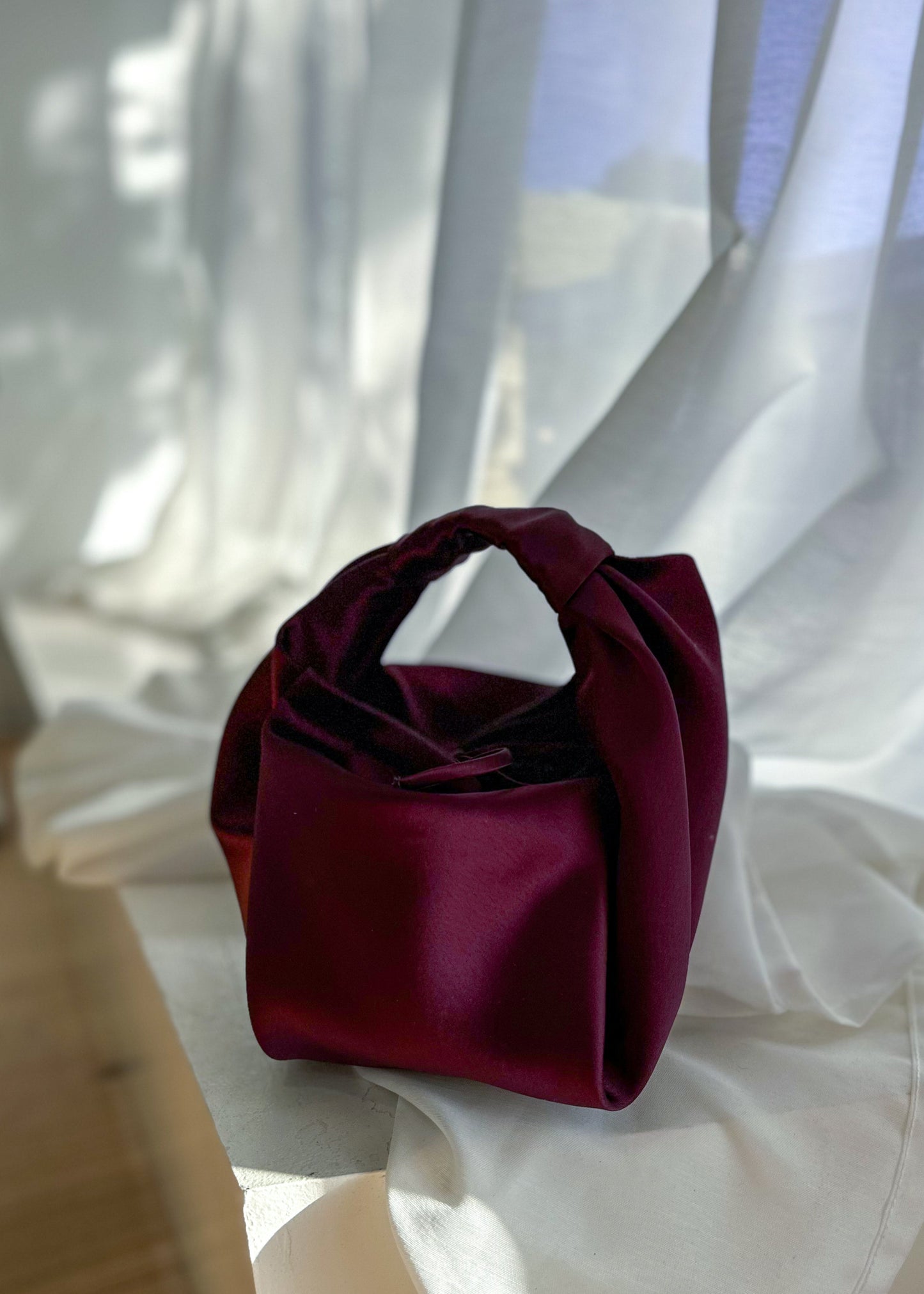 Couture + Love + Madness parachute bag, merlot