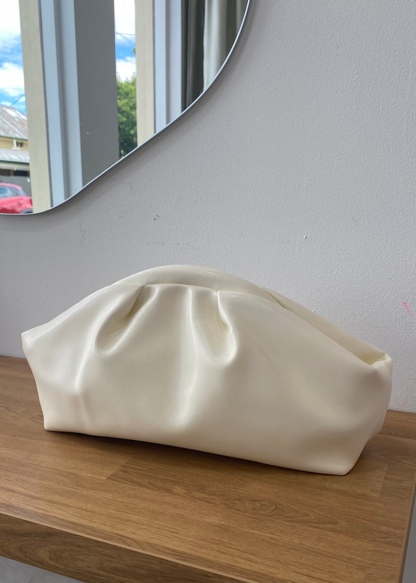 White duffle clutch