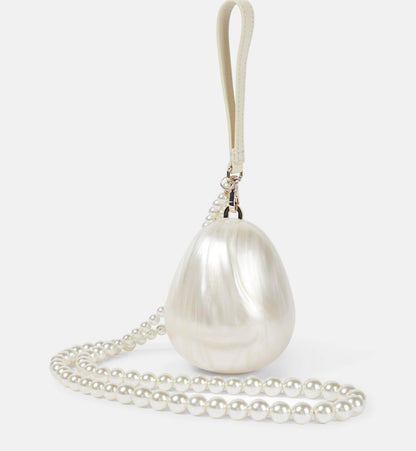 Simone Rocha egg leather- trimmed clutch – Plus One Dress Hire